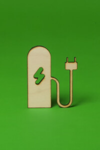 Wooden model of an EV charging point with a plug